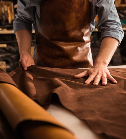 close-up-of-a-cobbler-working-with-leather-textile-resize.jpg